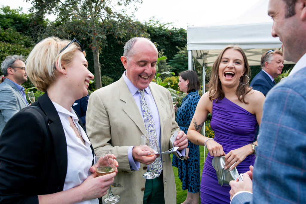 Wedding Magician in London Brendan Patricks performs at a summer reception.